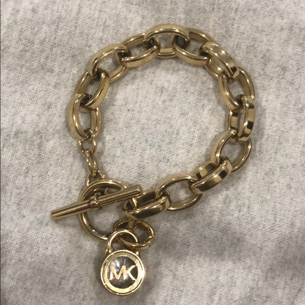 Michael Kors Gold Bracelet with logo charm